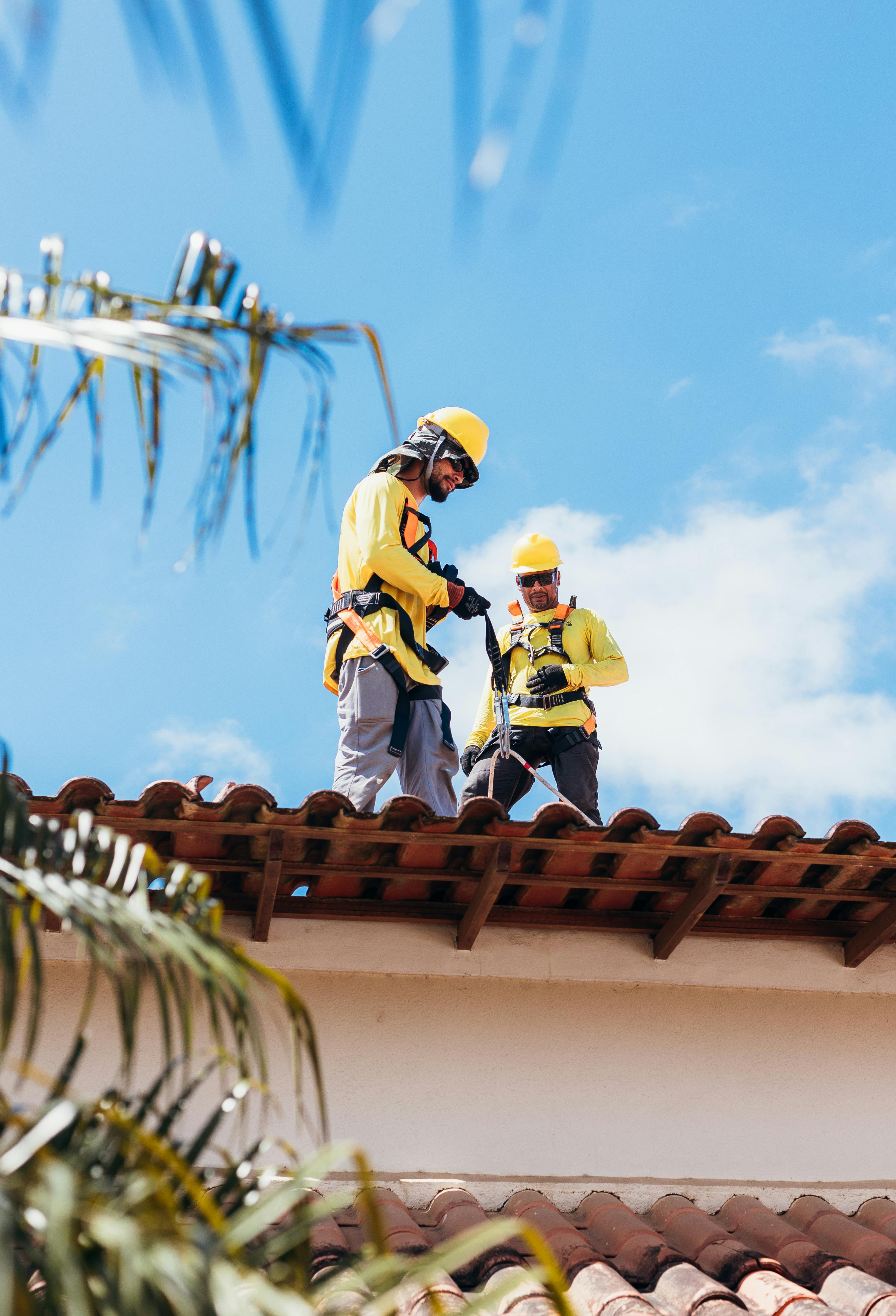HVAC professionals working on roof